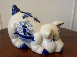 A LOVELY ORNAMENTAL PIG MONEY BOX. DUTCH SCENE.