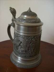 A PEWTER GERMAN BEER MUG WITH LID