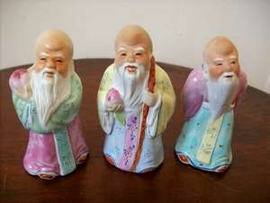 THREE ORIENTAL MEN ORNAMENTS.