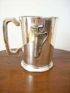 A SILVER PLATE GOLFERS BEER MUG