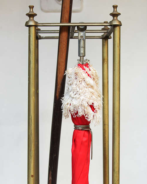 BRASS UMBRELLA/CANE STAND WITH HEAVY CAST IRON BASE