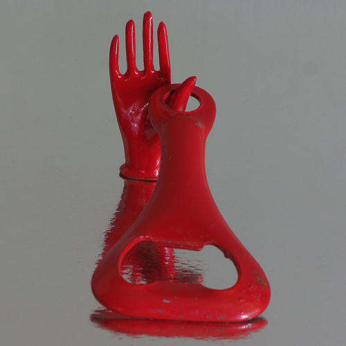 VINTAGE RED BOTTLE OPENER AND RED HAND, METAL
