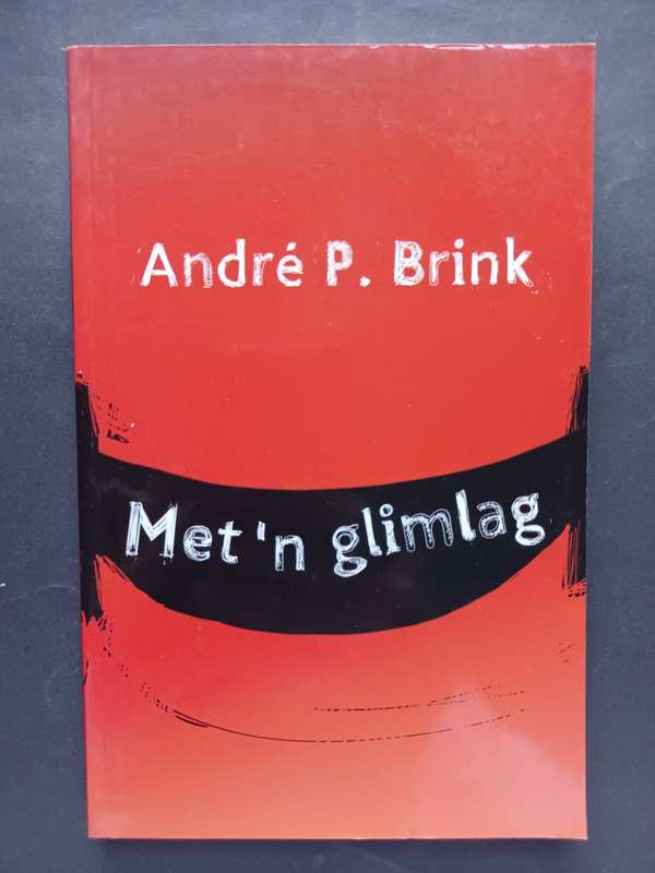 Met `n glimlag / Andre P. Brink