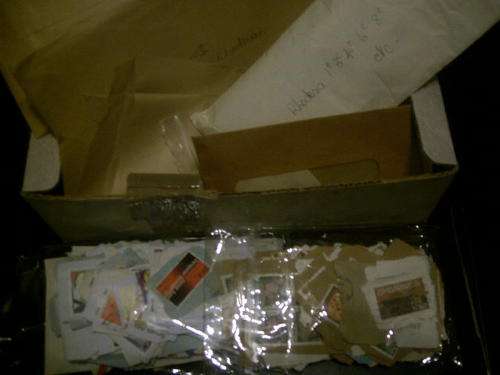 A box full of various Rhodesia and RSA Stamps on and off paper - take a look!