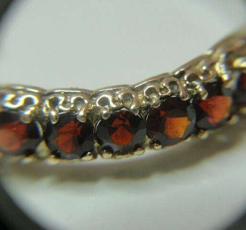 LATE ENTRY  !! GOLD AND GARNET ETERNITY RING