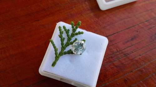 1.47 ct Si3 Round Off white/light blue Loose Moissanite