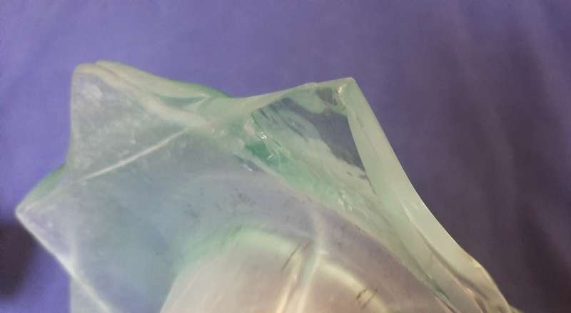 LARGE GREEN GLASS PETAL VASE WITH ORNATE METAL STAND