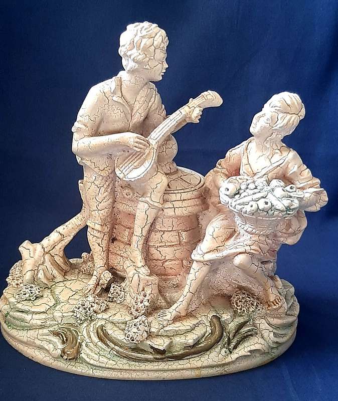 VINTAGE STATUE OF MAN SERENADING A WOMAN