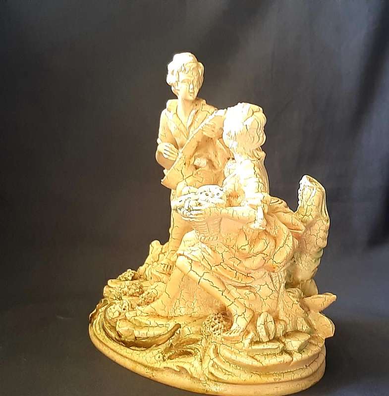 VINTAGE STATUE OF MAN SERENADING A WOMAN