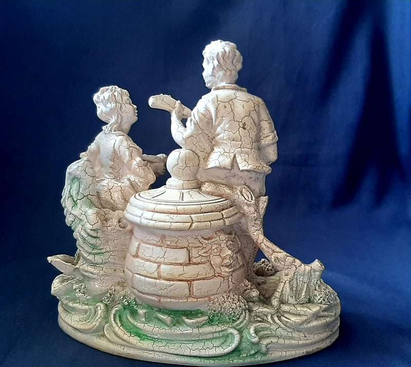 VINTAGE STATUE OF MAN SERENADING A WOMAN