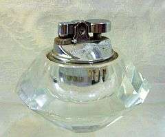 A vintage table lighter - in glass