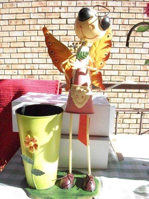 ***HUGE STANDING IRON DOLL WITH HUGE BUCKET FOR FLOWER *