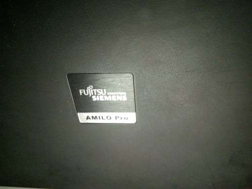 Fujitsu Siemans Amilo Pro!! PLEASE READ!!**** (BID FOR SPARES)!!  INCLUDES WIRED MOUSE AND CHARGER