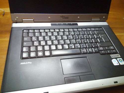 Fujitsu Siemans Amilo Pro!! PLEASE READ!!**** (BID FOR SPARES)!!  INCLUDES WIRED MOUSE AND CHARGER