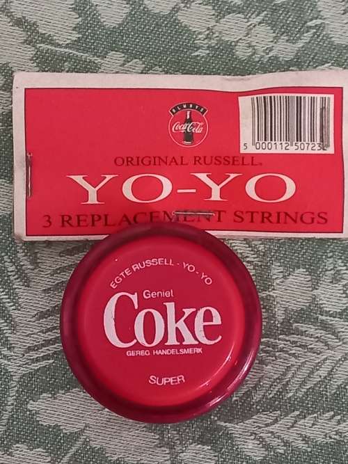 Vintage Russels yo yo coke with 3 pack of original strings.
