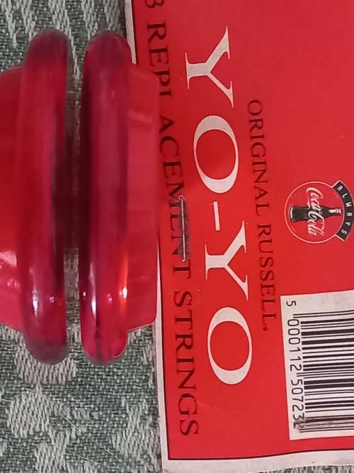 Vintage Russels yo yo coke with 3 pack of original strings.