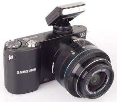 Samsung NX1000 - 20-50mm lens - 2 batteries + flash - brand new!