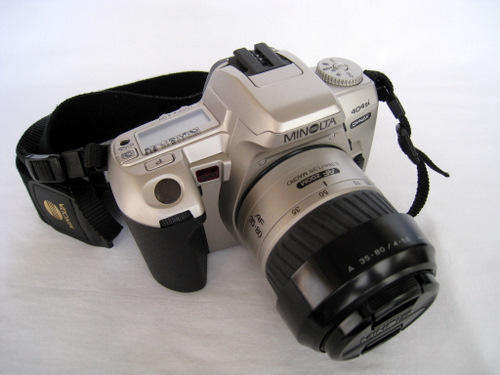 A STUNNING 'VINTAGE' MINOLTA DYNAX 404si CAMERA & LENS!!! An absolute STEAL at R1.00 start!!!