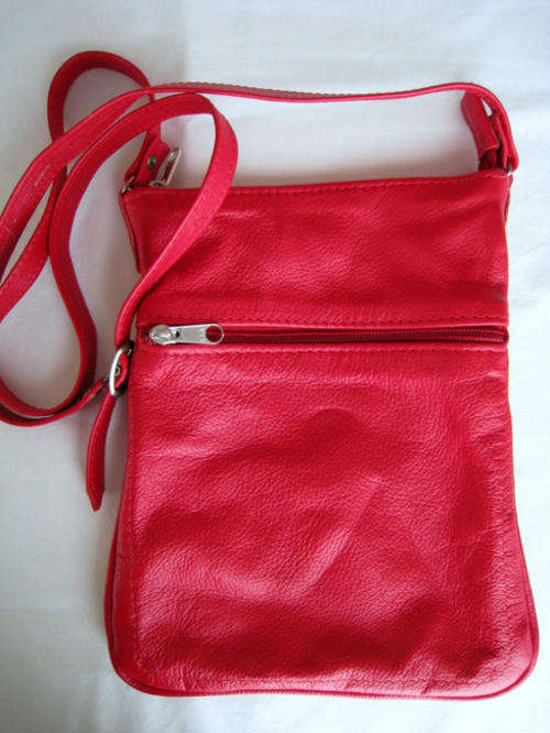 A BEAUTIFUL RED, GENUINE LEATHER SLING BAG - Just the perfect size!