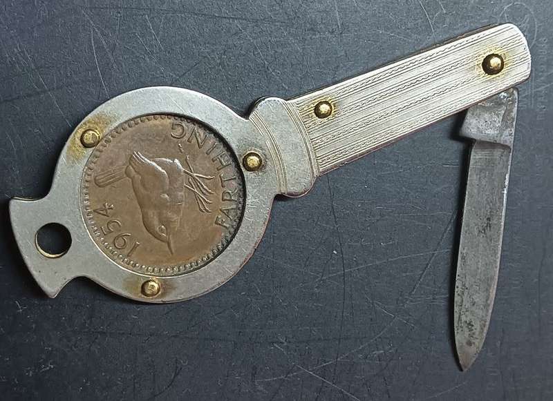 Queen Elizabeth 11 Farthing 1954 mounted in a souvenir penknife.