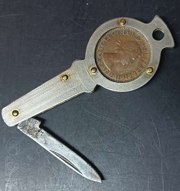 Queen Elizabeth 11 Farthing 1954 mounted in a souvenir penknife.