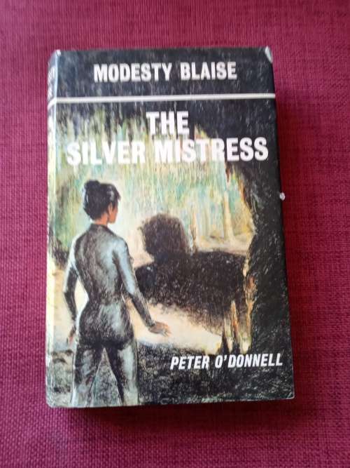Modesty Blaise, The Silver Mistress by Peter O´Donnell. 1st edition 1973. H/C with jacket. 254 pp.
