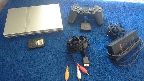 Playstation 2 with eyetoy, singstar, V8 Racer,50 games and accessories