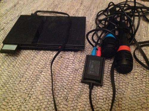 Playstation 2 with games and SingStar mics