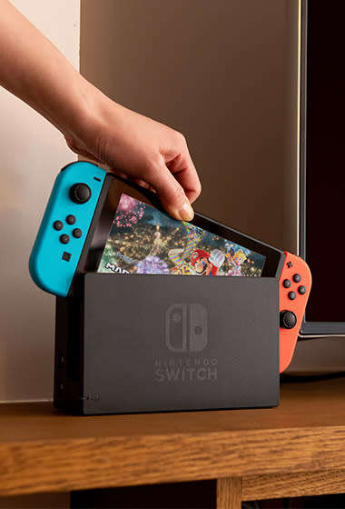 Nintendo Switch Console (With Neon Red And Neon Blue Joy-Con) + Extras
