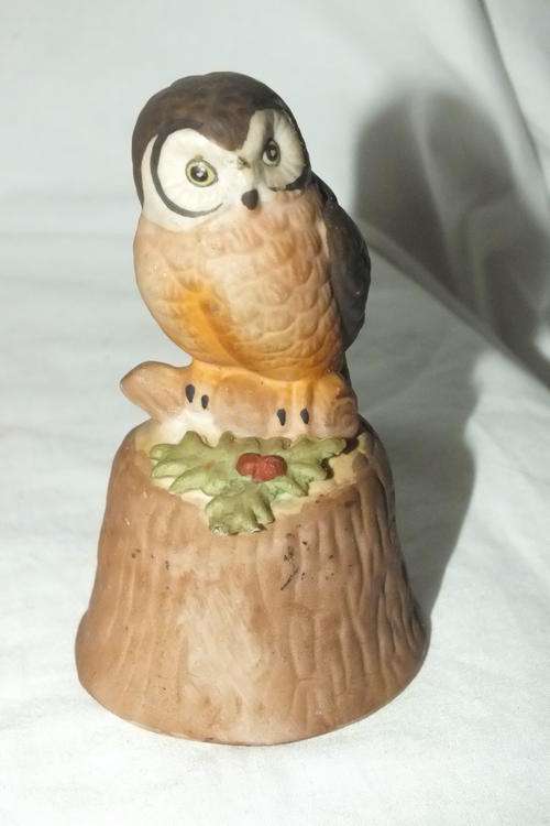 Owl Sitting On Stump With Bell