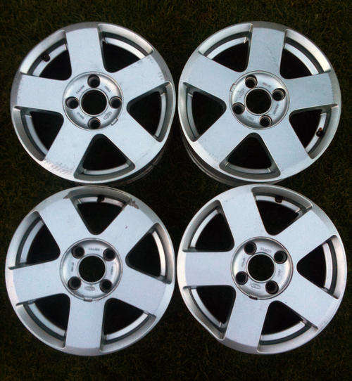 Original Ford Fiesta Mags complete with caps and wheel nuts starting R1
