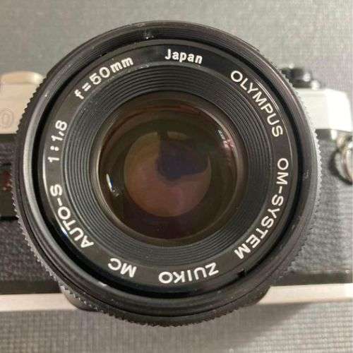 Olympus OM10 35mm film camera with lens
