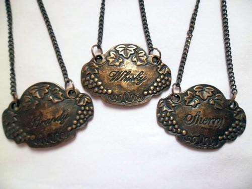 THREE SMALL VINTAGE BRONCE BOTTLE DECANTER LABELS HANG TAGS, WHISKY - BRANDY - SHERRY