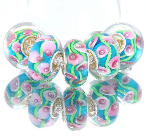 EUROPEAN STYLE - 925 SILVER CORE - GLASS BEADS - CLEAR WITH PINK, GREEN AND BLUE INNER LILLY FLOWERS