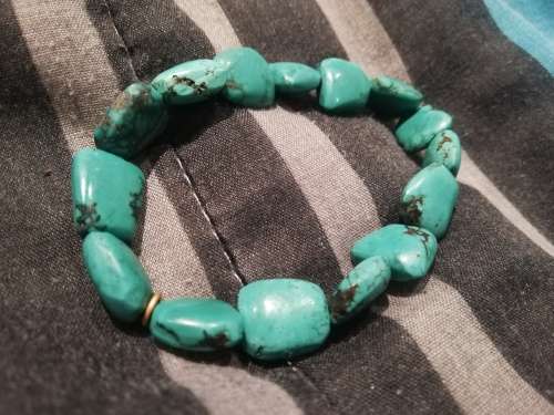 Elasticated turquoise gem stone bracelet, stones are not small.