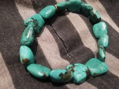 Elasticated turquoise gem stone bracelet, stones are not small.