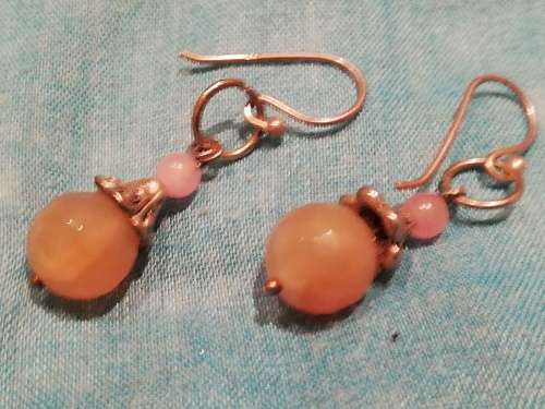8 x dangle earrings, some with glass or gems. And one wire cross, Bulk sale together.