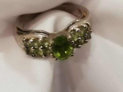 Marked 925 vintage ring with lovely peridot stones.