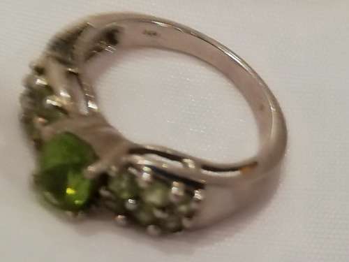 Marked 925 vintage ring with lovely peridot stones.