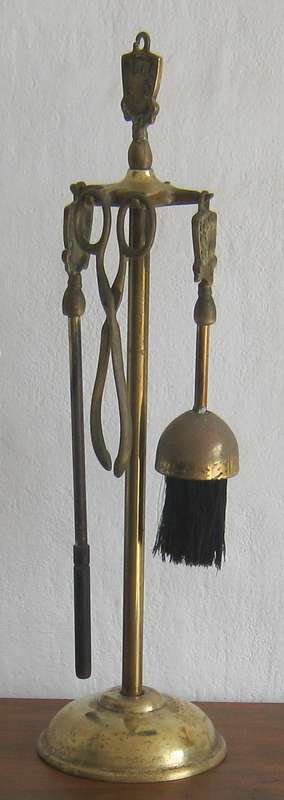 BRASS FIRE IRONS ON A STAND