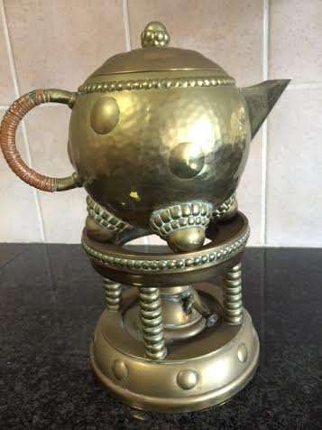 ANTIQUE BRASS KETTLE, hand hammered and on a stand
