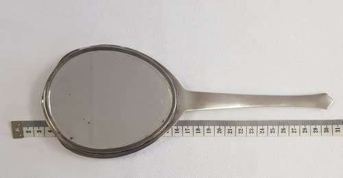 Silver hand held mirror - as per scan