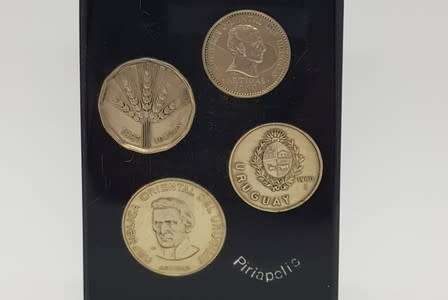 Lot of 4 Uruguay coins set in resin as per photo
