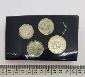 Lot of 4 Uruguay coins set in resin as per photo