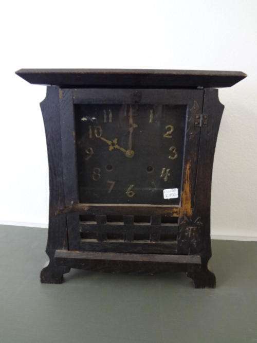 Black wooden clock as per scan