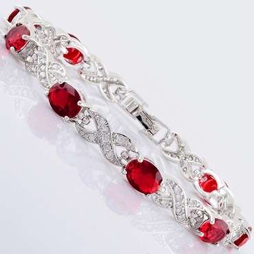 **BEAUTIFUL WHITE GOLD OVAL CUT RED RUBY TENNIS BRACELET**