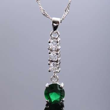 **STUNNING WHITE GOLD EMERALD AND SIMULATED DIAMOND PENDANT WITH CHAIN**