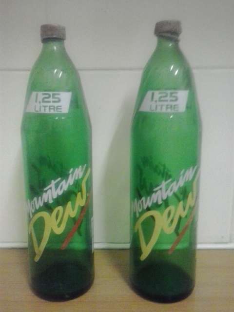 Mountain Dew  bottles X 2  . one bid takes both