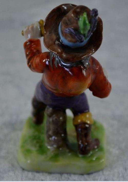 reserved for charles CONTINENTAL PORCELAIN HUNCHBACK WITH KNIVES -  from SUEZYT