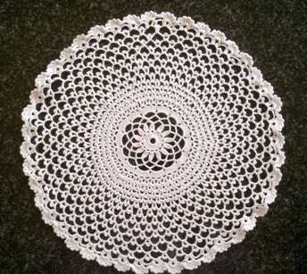Striking white cotton crochet doilie 30cm